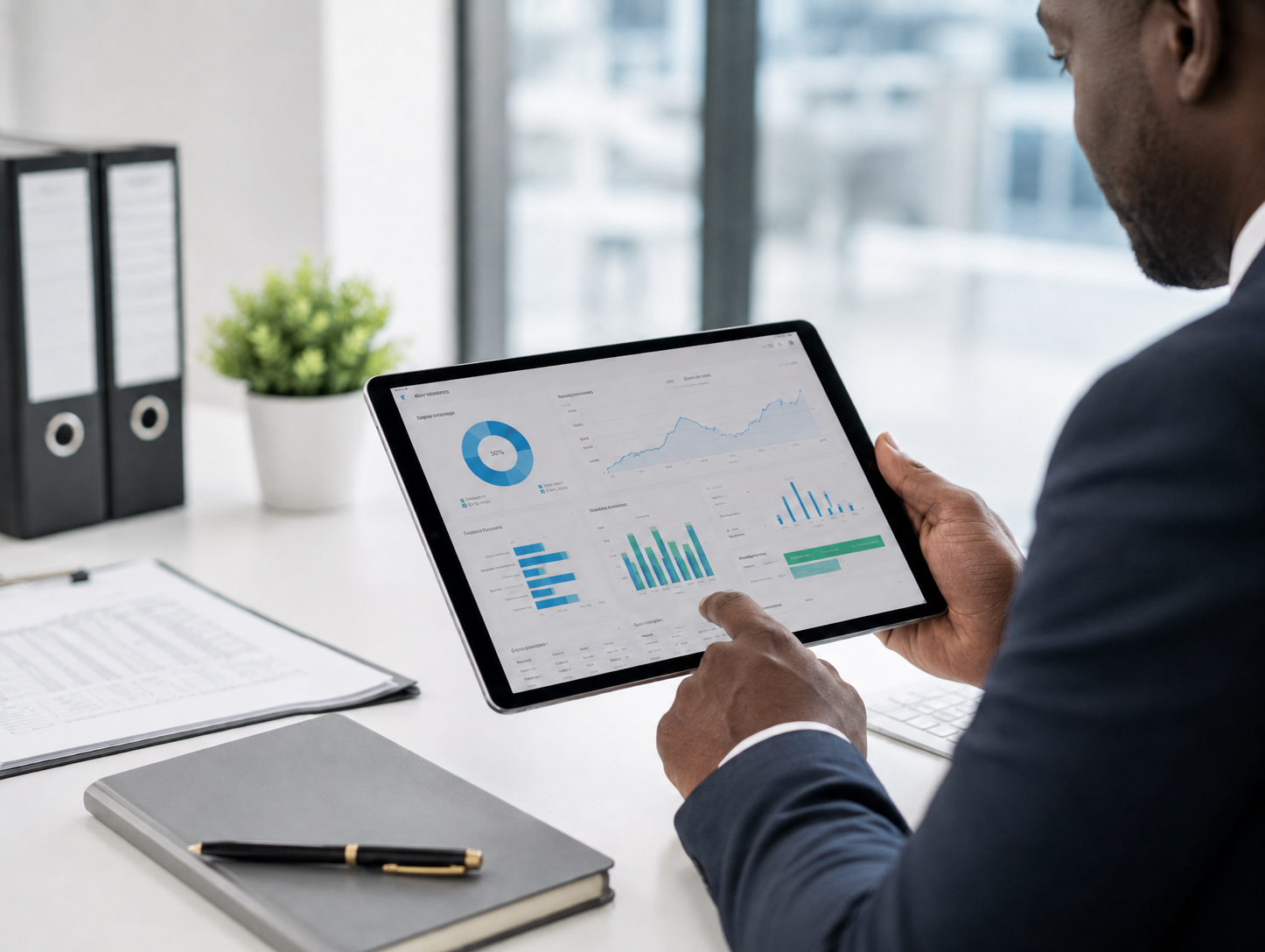 Two professionals reviewing the Debtcol Pro account overview dashboard on a laptop